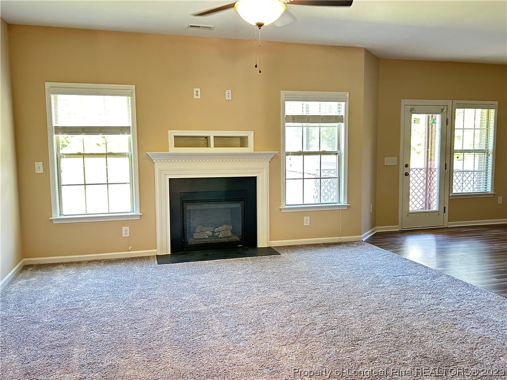 145 Taplow Trail Cameron, NC 28326 - Photo 4 of 15 a view of empty room with a fireplace and window