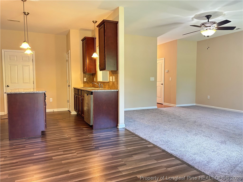 145 Taplow Trail Cameron, NC 28326 - Photo 6 of 15 a view of a kitchen with furniture and wooden floor