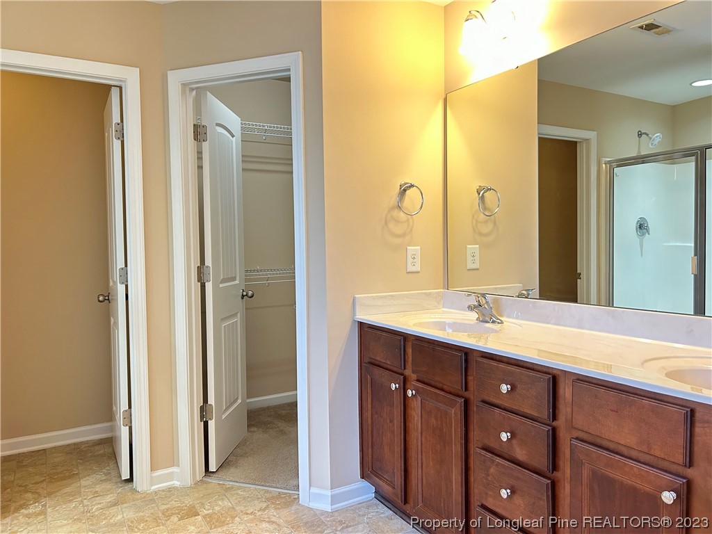 145 Taplow Trail Cameron, NC 28326 - Photo 8 of 15 a bathroom with a granite countertop sink mirror and double