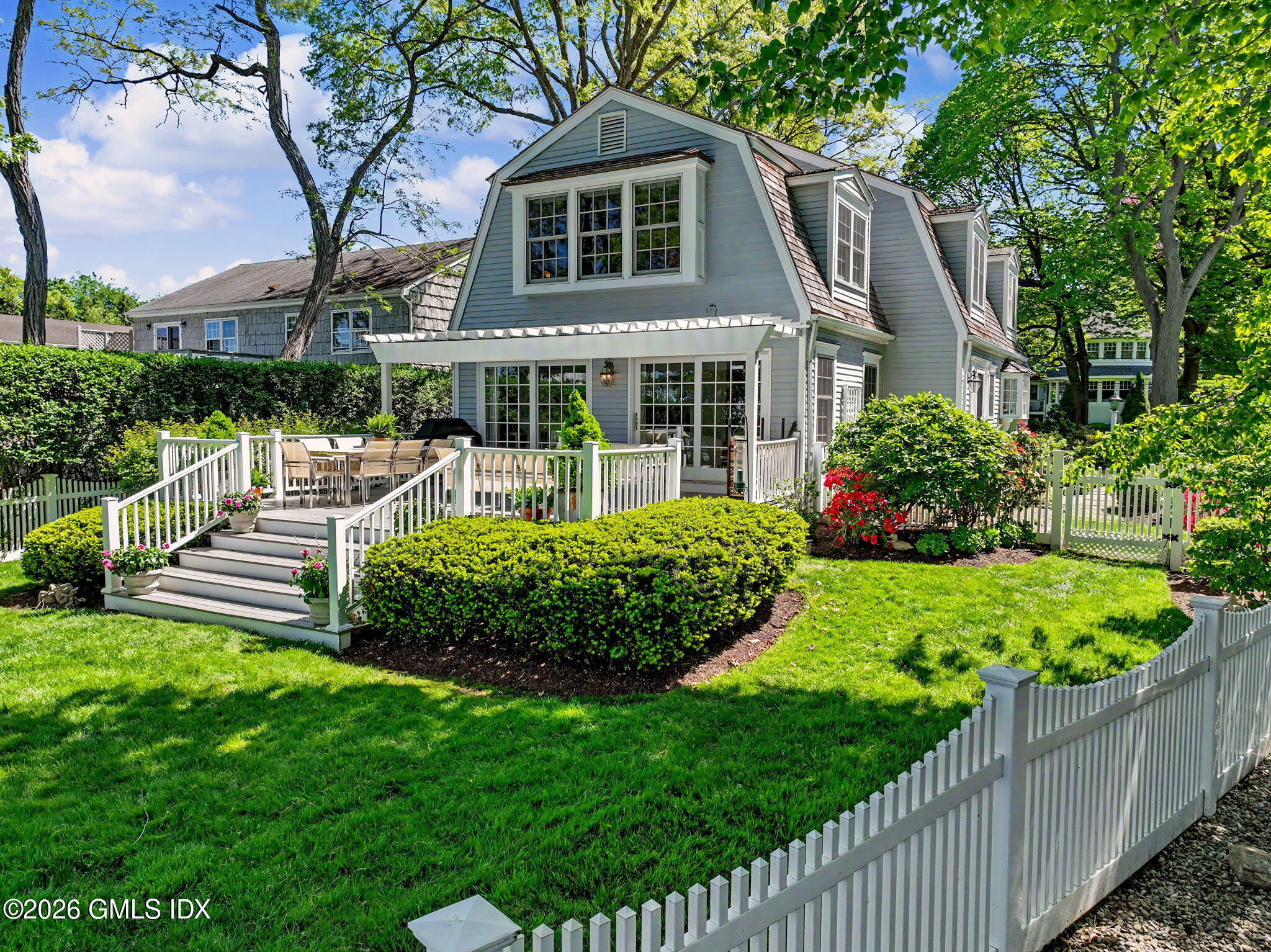 10 Newton Street Riverside, CT 06878 - Photo 25 of 28 a front view of a house with a yard table and chairs