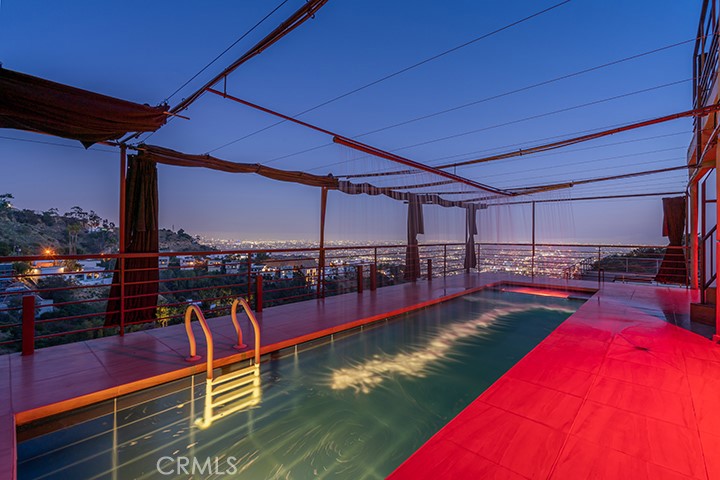 2189 B Sunset Plaza Drive Los Angeles, CA 90069 - Photo 50 of 53 a view of a swimming pool with a lounge chair