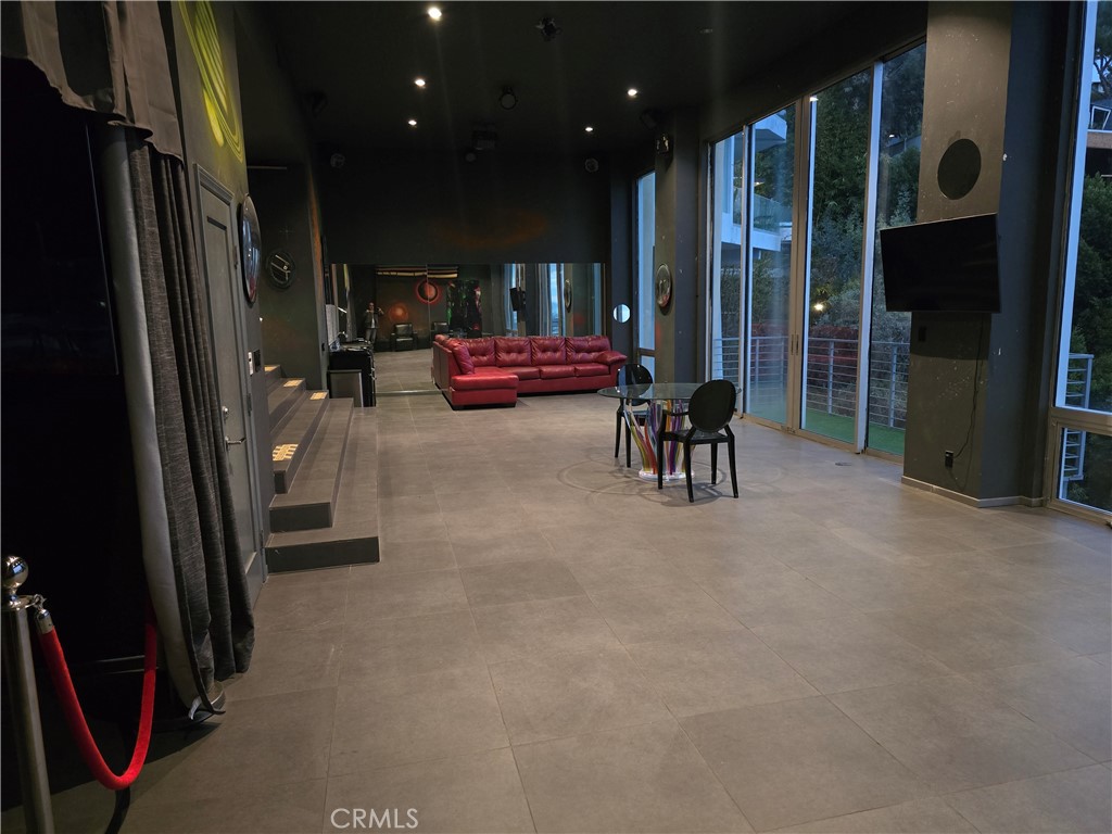 2189 B Sunset Plaza Drive Los Angeles, CA 90069 - Photo 10 of 53 a living room with furniture and a glass door
