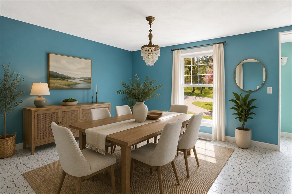 3 Fairway Drive Canton, MA 02021 - Photo 9 of 34 a dining room with furniture potted plants and wooden floor