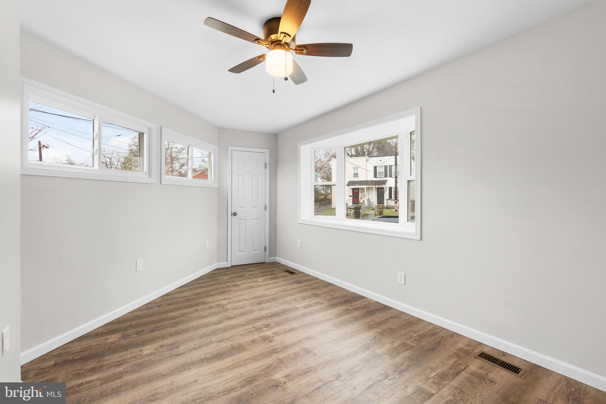 4686 A Street Southeast Washington, DC 20019 - Photo 11 of 28 wooden floor in an empty room with a window