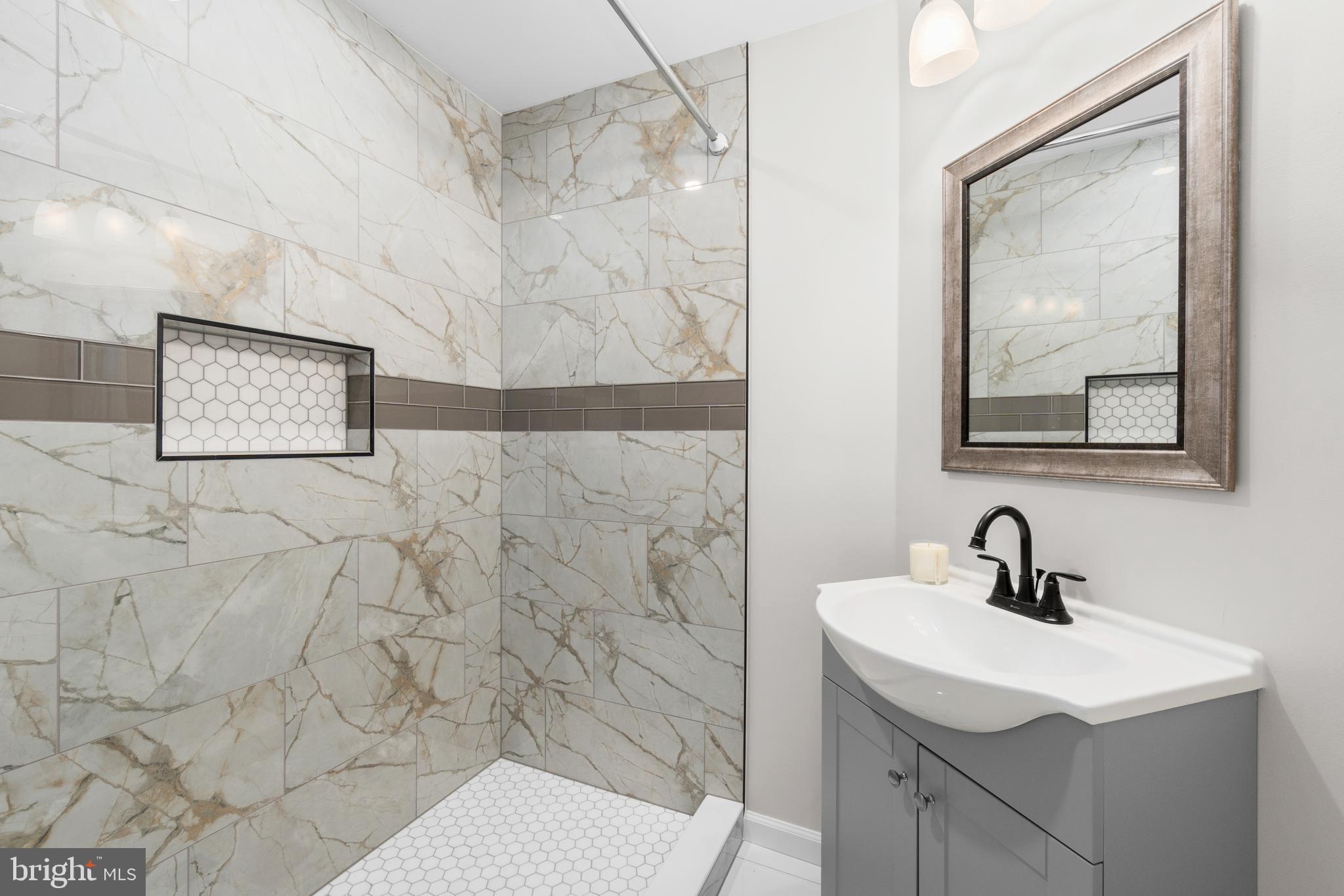 4686 A Street Southeast Washington, DC 20019 - Photo 13 of 28 a bathroom with a sink and mirror