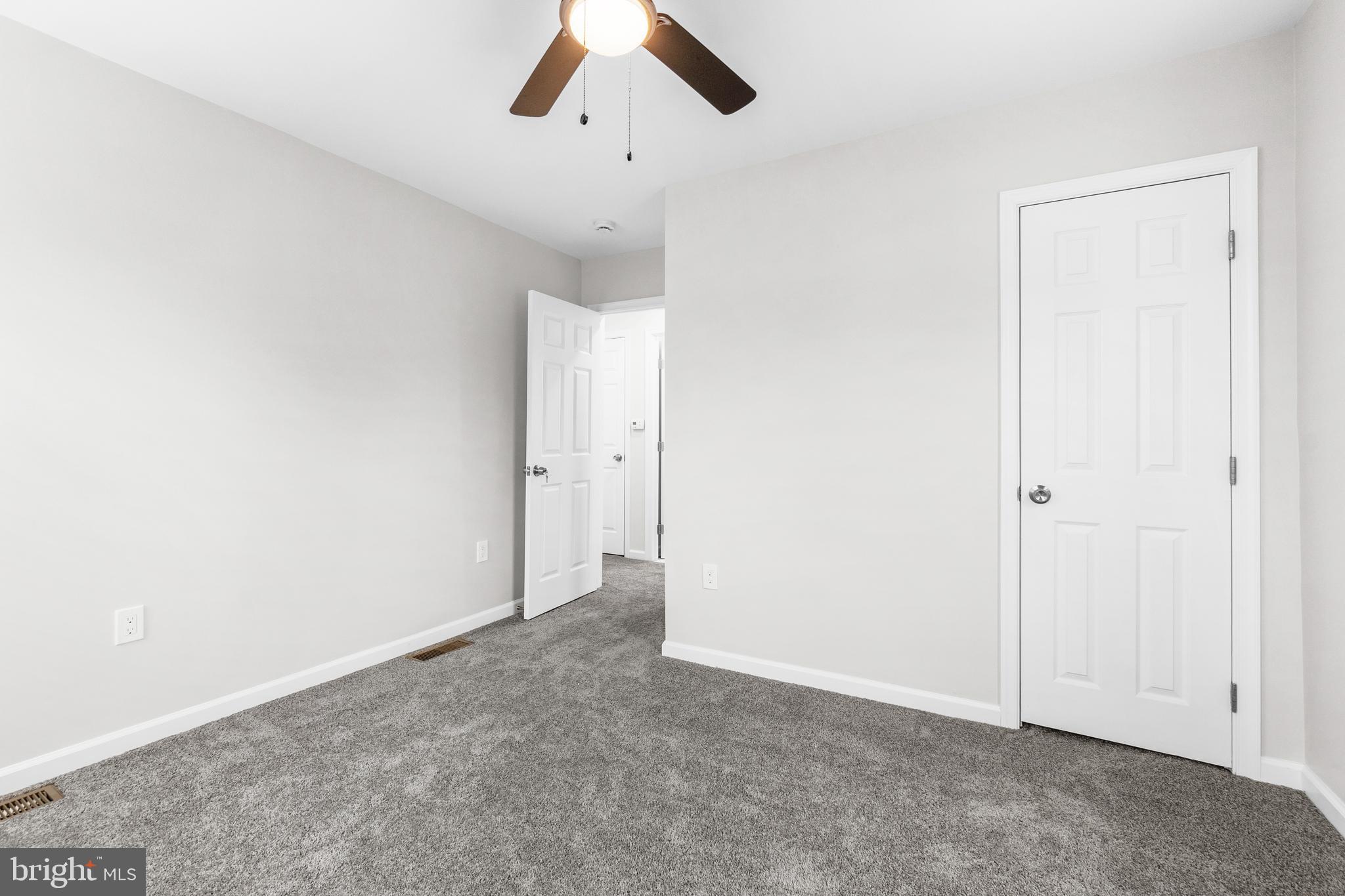 4686 A Street Southeast Washington, DC 20019 - Photo 15 of 28 an empty room with chandelier fan
