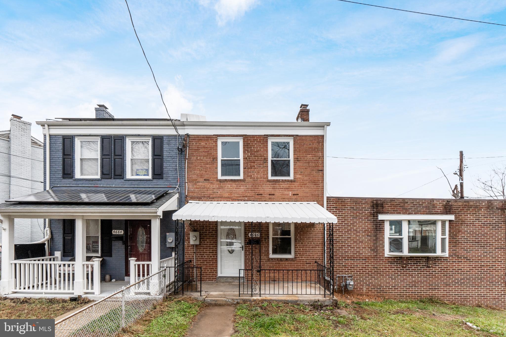 4686 A Street Southeast Washington, DC 20019 - Photo 2 of 28 a front view of a house with a yard