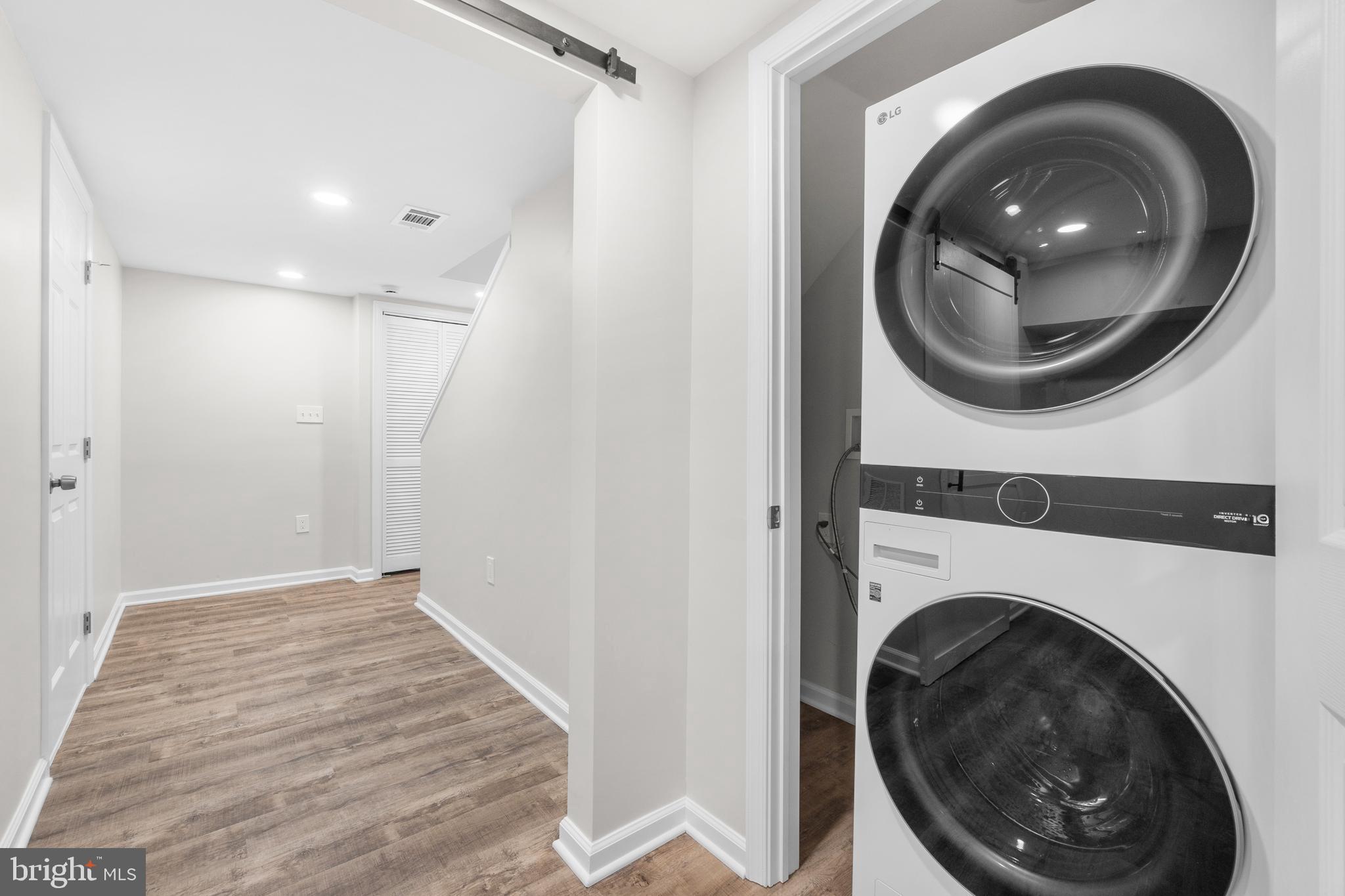 4686 A Street Southeast Washington, DC 20019 - Photo 26 of 28 a view of a hallway with washer and dryer