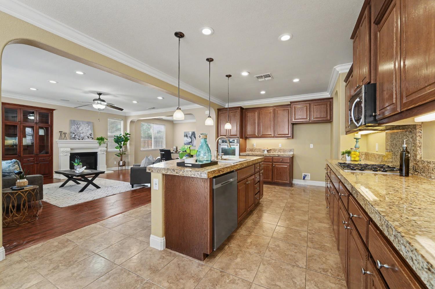 1223 East Springer Drive Turlock, CA 95382 - Photo 20 of 48 a kitchen with stainless steel appliances granite countertop a stove oven and a refrigerator