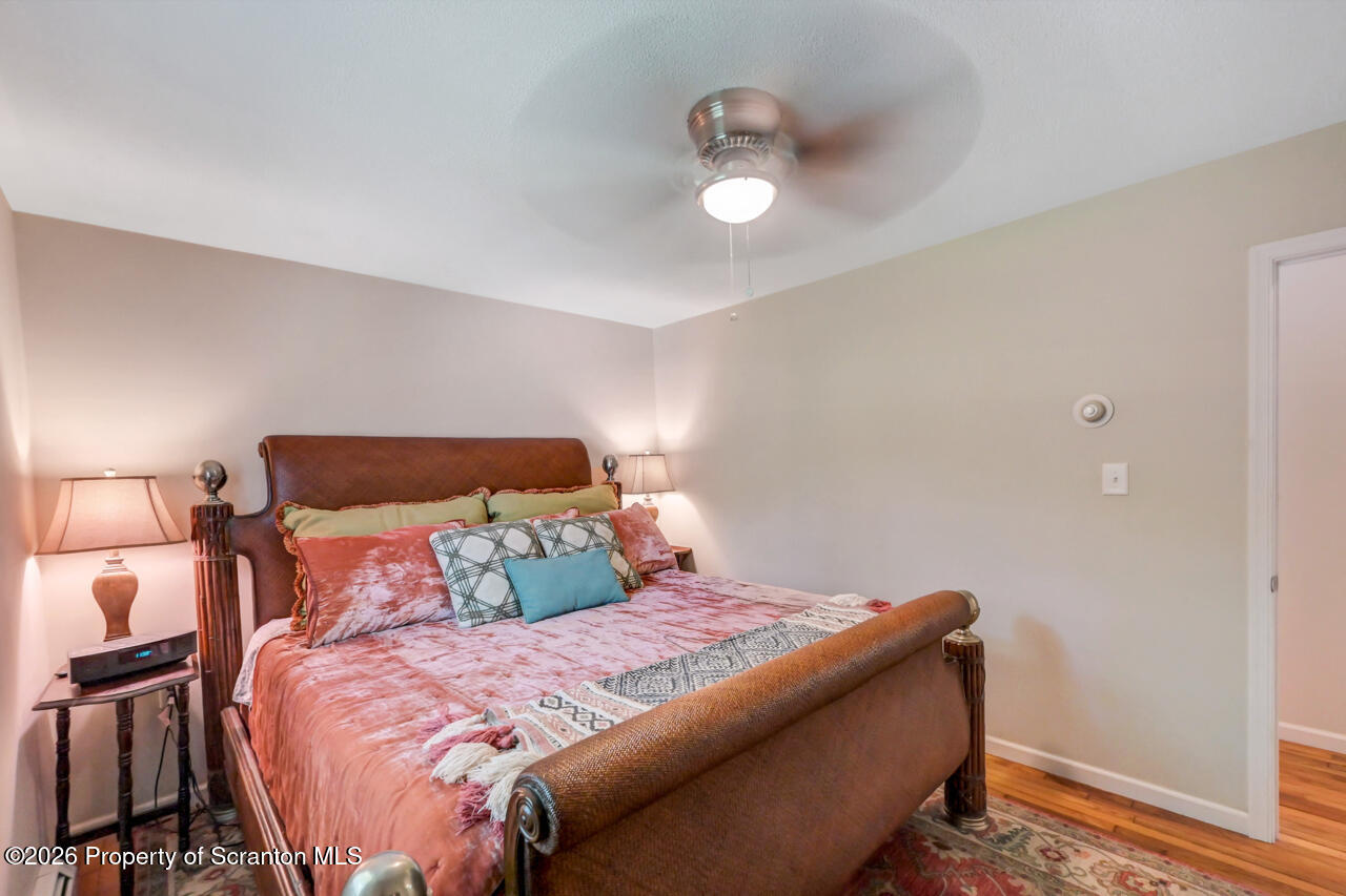 3660 Aberdeen Road Moscow, PA 18444 - Photo 36 of 68 a bedroom with a bed and a lamp