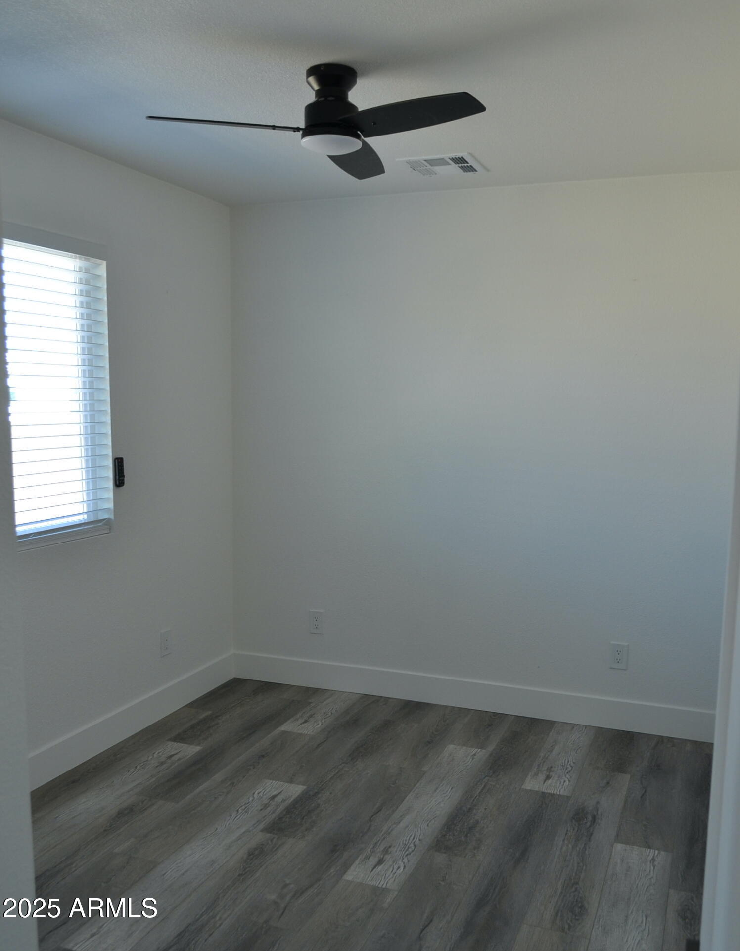44 North Mountain Road, Unit 2 Apache Junction, AZ 85120 - Photo 5 of 7 a view of a room with wooden floor and windows