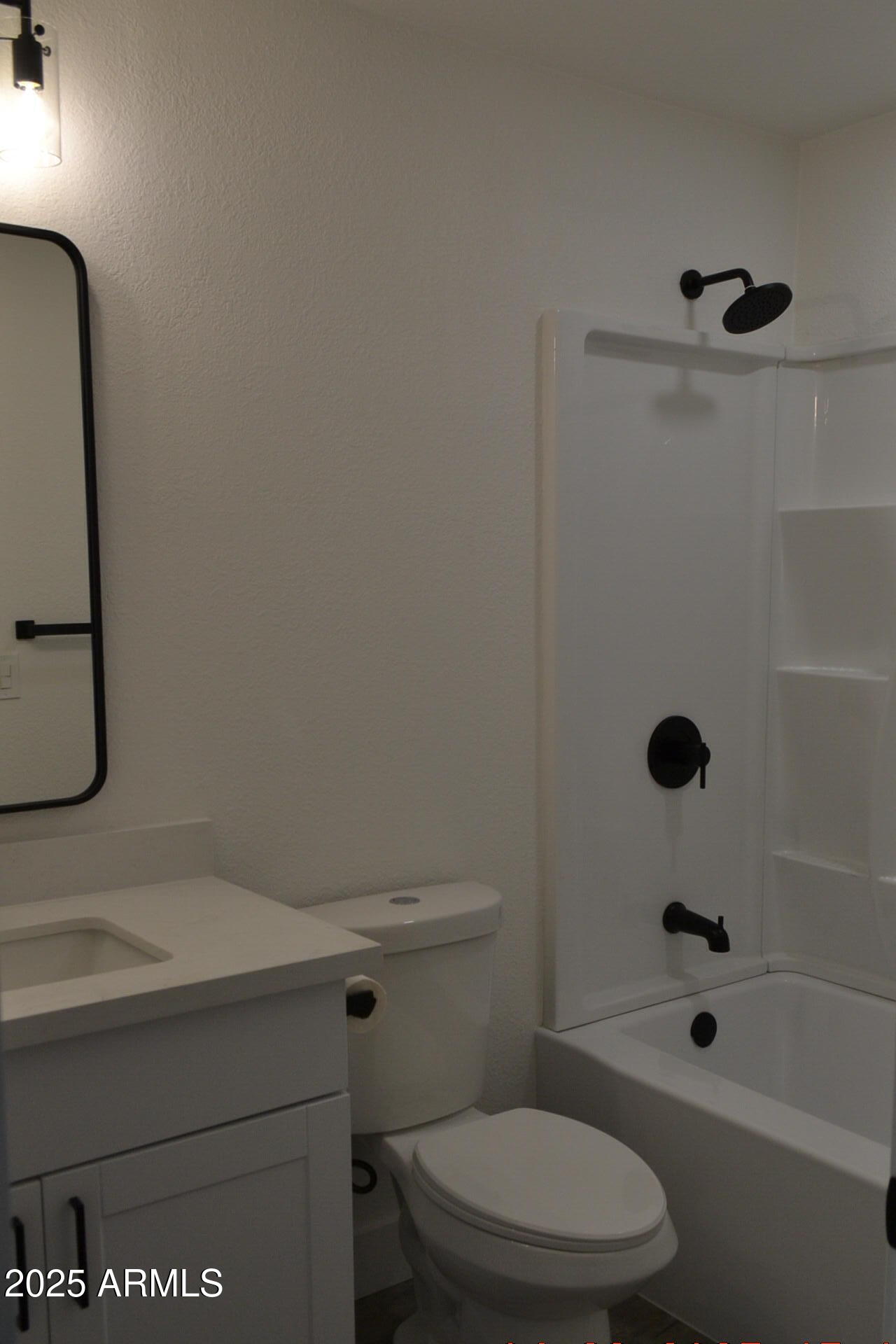 44 North Mountain Road, Unit 2 Apache Junction, AZ 85120 - Photo 6 of 7 a bathroom with a sink a toilet and shower