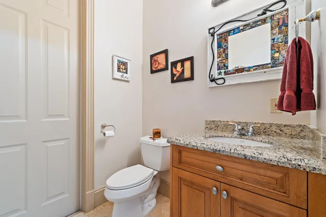 a spacious bedroom with a bed a couch and a window