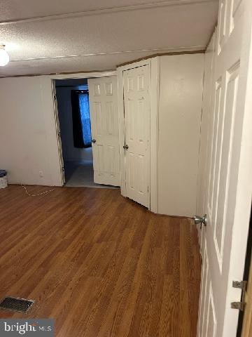 1679 South State Street, Unit A50 Dover, DE 19901 - Photo 3 of 6 a view of hallway with wooden floor