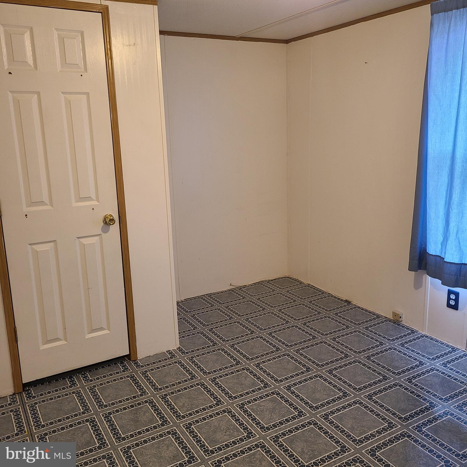 1679 South State Street, Unit A50 Dover, DE 19901 - Photo 5 of 6 a view of a room with wooden floor