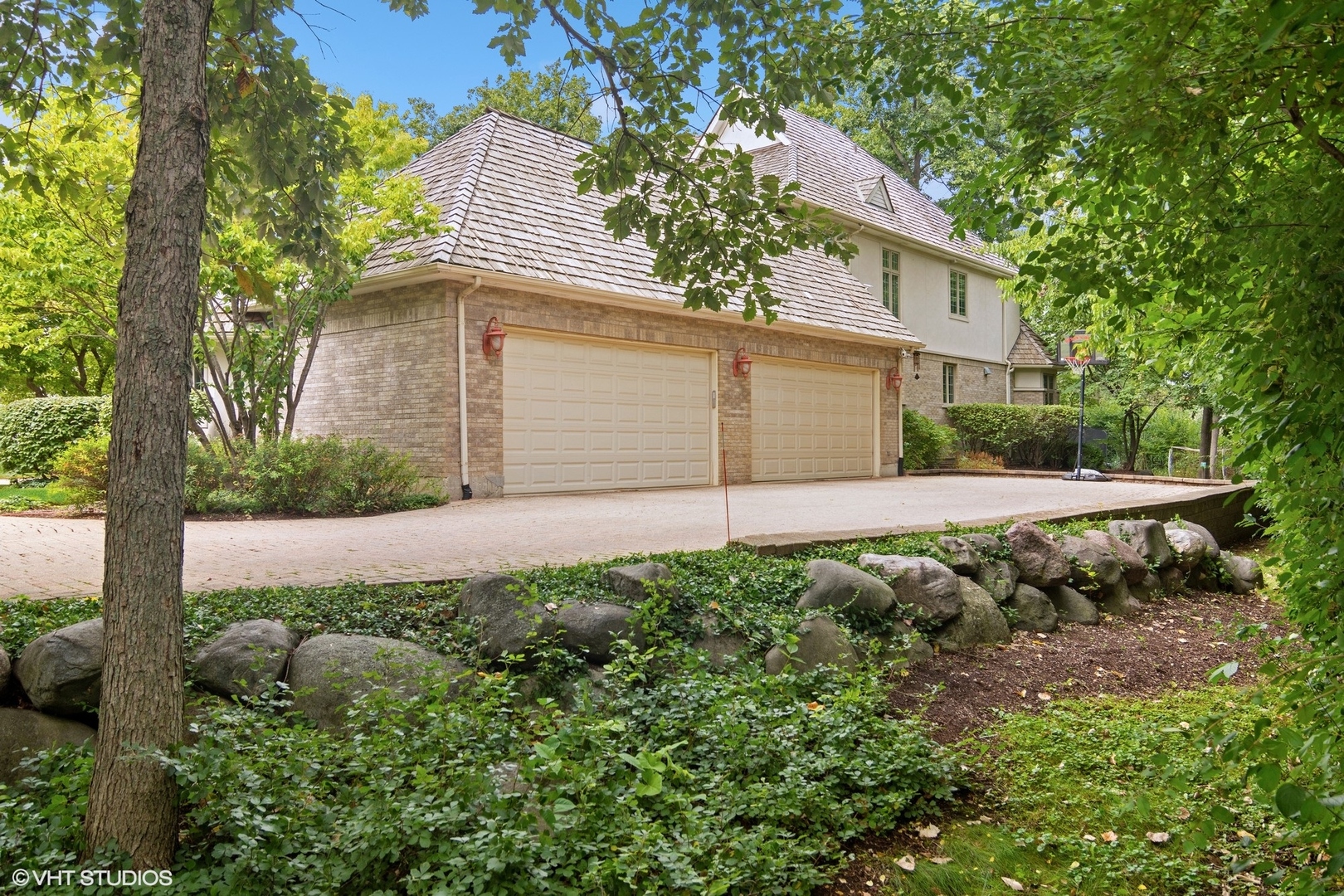 4713 Wellington Drive Long Grove, IL 60047 - Photo 6 of 8 a front view of a house with a yard and garage