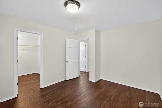 an empty room with wooden floor