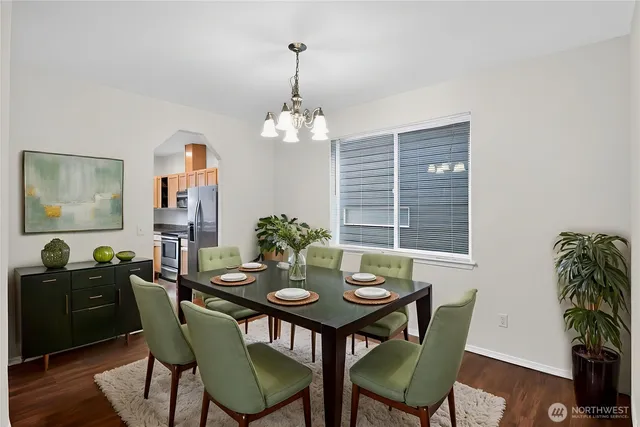 a view of a dining room with furniture and window