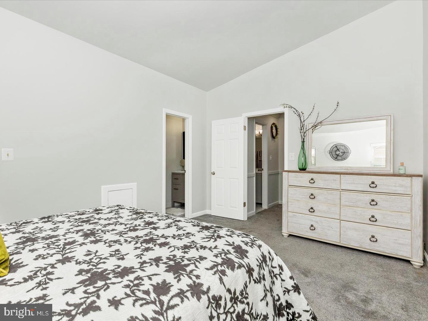11349 Appledowre Way, Unit 313 Germantown, MD 20876 - Photo 13 of 27 a bedroom with a bed and a dresser
