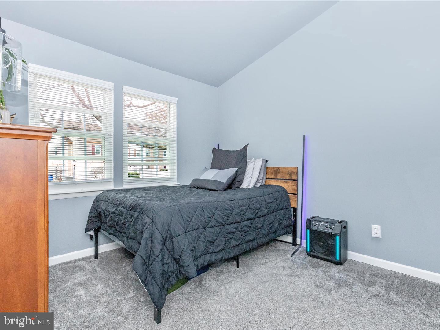 11349 Appledowre Way, Unit 313 Germantown, MD 20876 - Photo 17 of 27 a bedroom with a bed and a window
