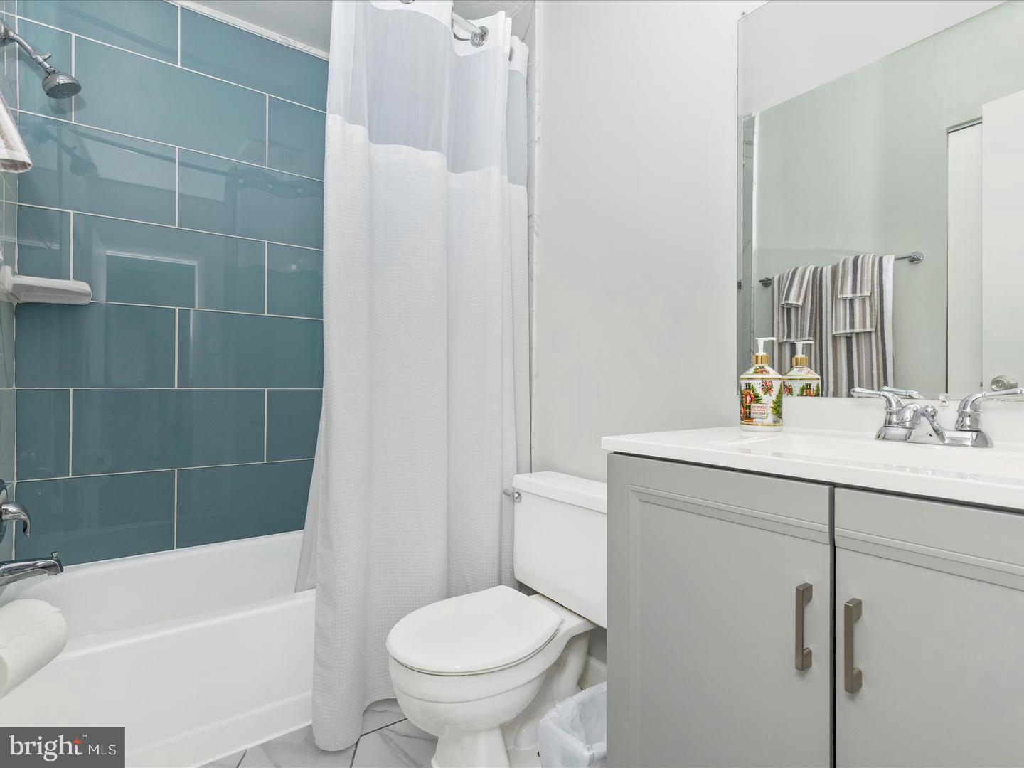 11349 Appledowre Way, Unit 313 Germantown, MD 20876 - Photo 18 of 27 a bathroom with a sink toilet and shower