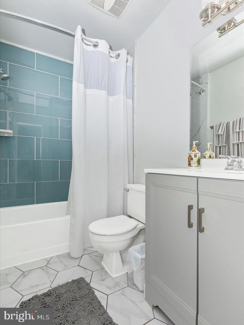 11349 Appledowre Way, Unit 313 Germantown, MD 20876 - Photo 19 of 27 a bathroom with a sink toilet and shower