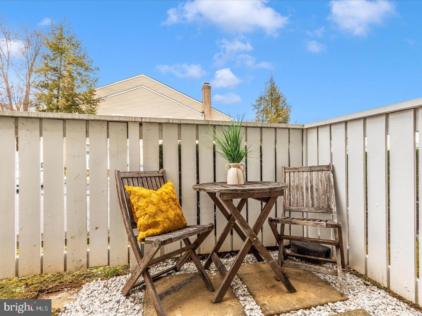 11349 Appledowre Way, Unit 313 Germantown, MD 20876 - Photo 25 of 27 a balcony with table and chairs