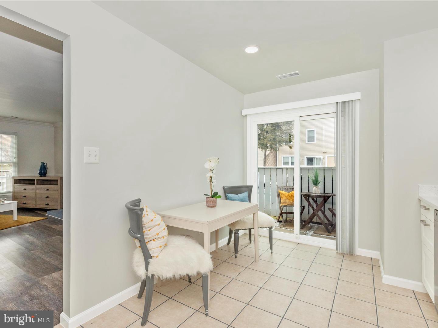 11349 Appledowre Way, Unit 313 Germantown, MD 20876 - Photo 6 of 27 a view of a dining room with furniture