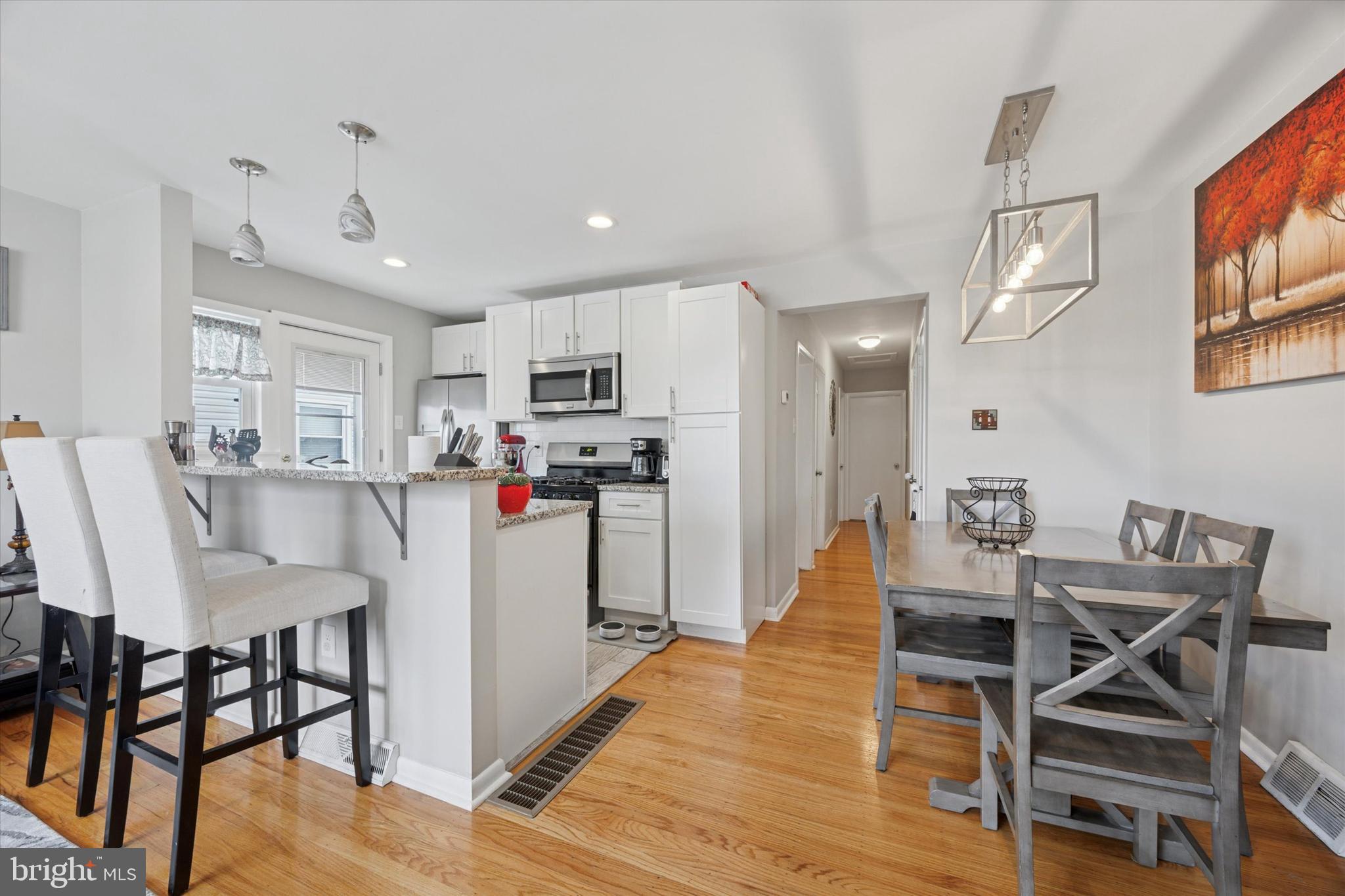 219 Ridley Avenue Folsom, PA 19033 - Photo 5 of 19 Living Room, Kitchen, Dining