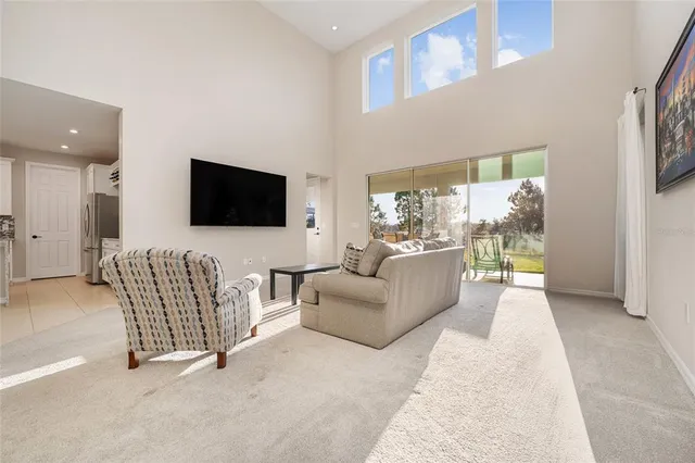 a kitchen with granite countertop white cabinets and stainless steel appliances