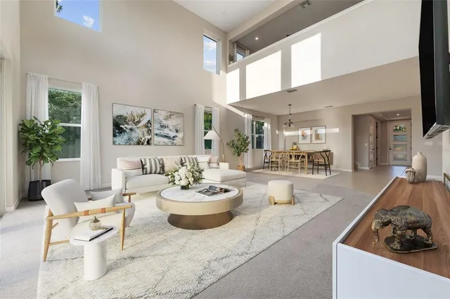 a view of kitchen with stainless steel appliances kitchen island granite countertop a refrigerator and a stove top oven