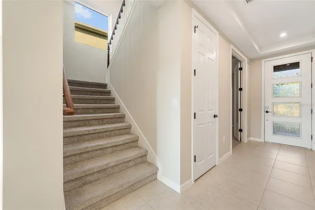 a spacious bathroom with a granite countertop sink a mirror and a