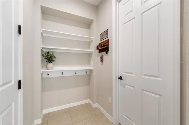 an aerial view of multiple houses with a lake view