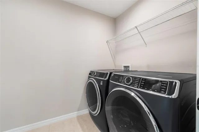 an aerial view of a house with a lake view