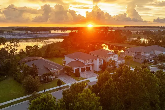 an aerial view of residential houses with outdoor space