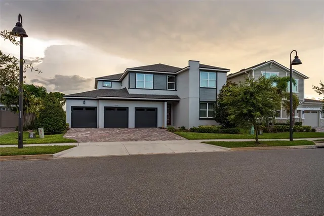 a view of a yard with a house in the background