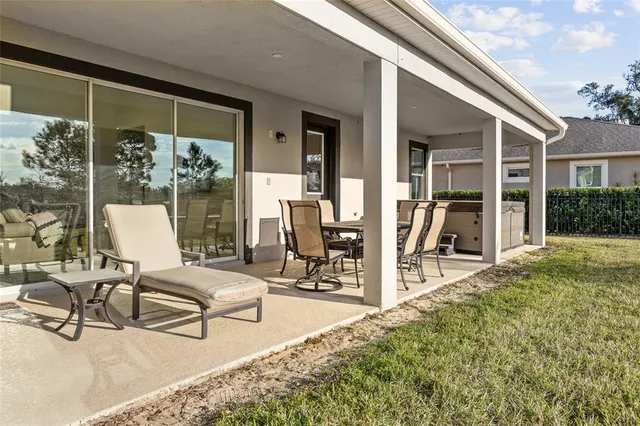 a kitchen with granite countertop a sink a stove and cabinets