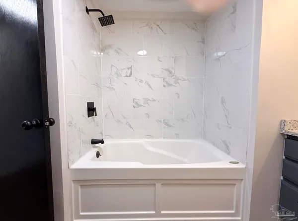 a bathroom with a bathtub