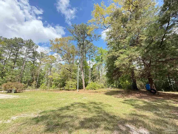 a view of a chairs and table in a patio