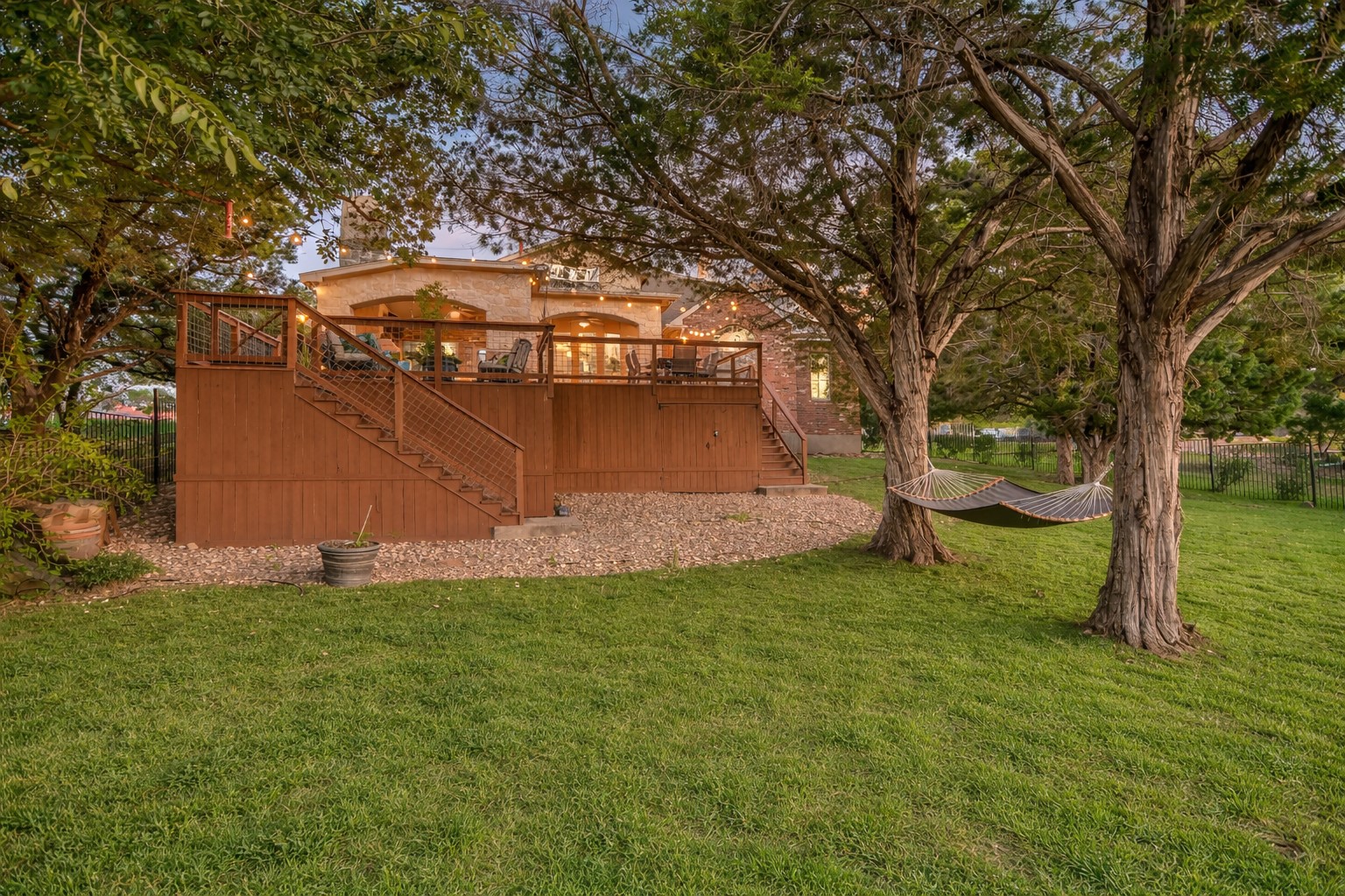 300 Wesley Ridge Drive Spicewood, TX 78669 - Photo 35 of 40 The spacious elevated deck not only serves as a relaxing outdoor haven but also offers an abundance of hidden storage underneath. (*Photo has been virtually staged to reflect a spring landscape.)