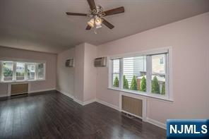 310 Union Street Carlstadt, NJ 07072 - Photo 7 of 24 a view of an empty room with wooden floor and a window