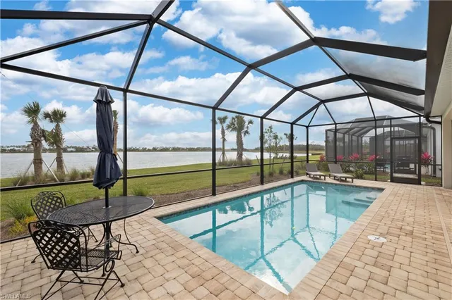 a view of a swimming pool with a lounge chair