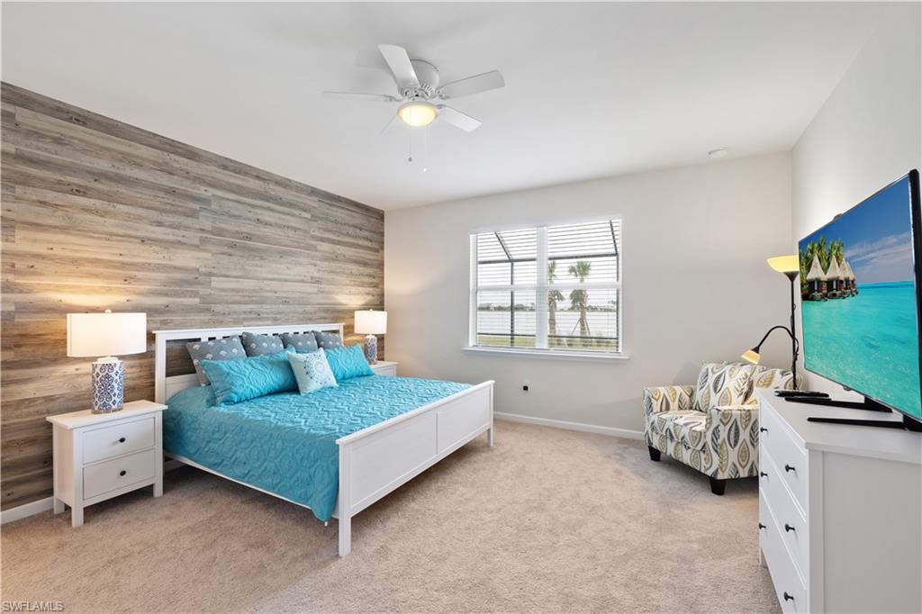 42098 Journey Drive Babcock Ranch, FL 33982 - Photo 12 of 19 a living room with furniture and a flat screen tv