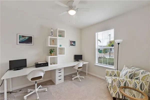 a work room with furniture and windows