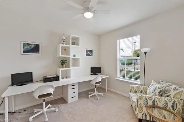 a work room with furniture and windows
