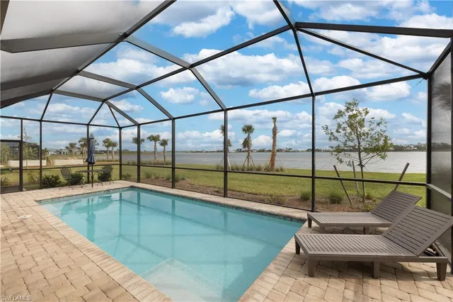 a indoor swimming pool with a glass door