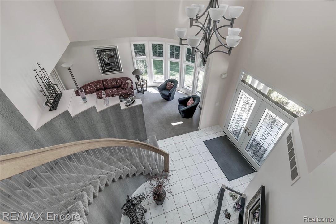 6775 Oakhurst Ridge Road Clarkston, MI 48348 - Photo 16 of 37 Unique Curved Staircase