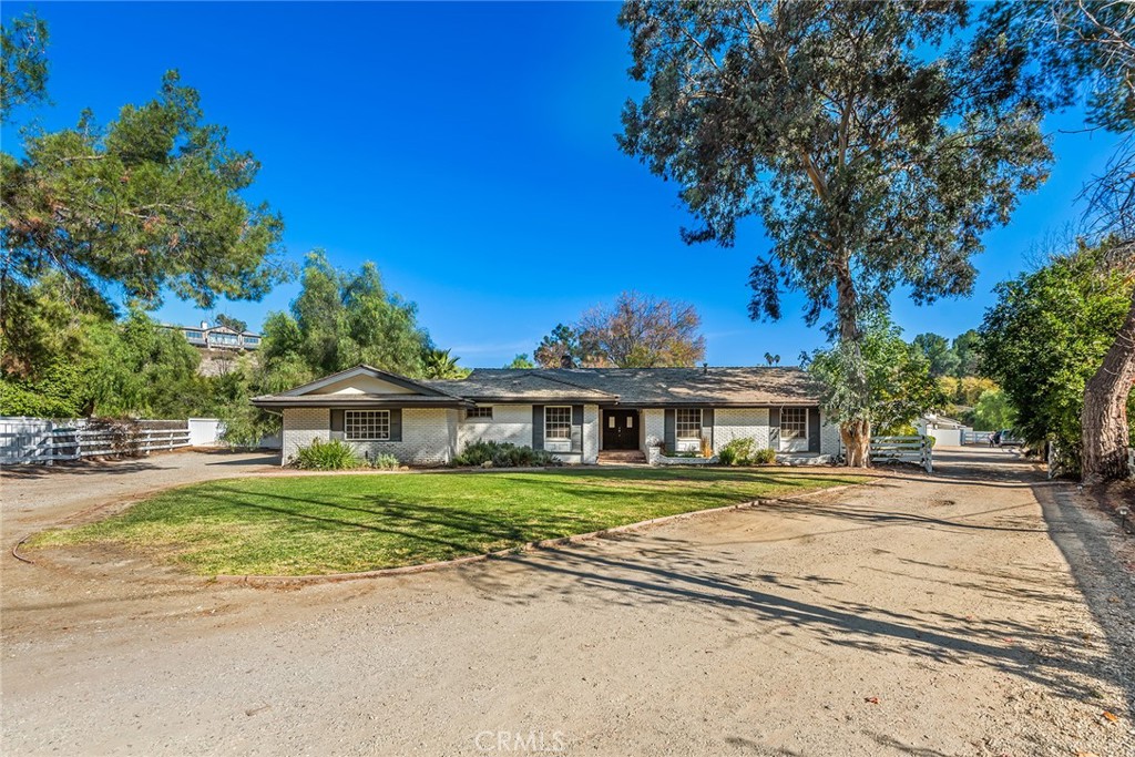 5547 Paradise Valley Road Hidden Hills, CA 91302 - Photo 11 of 12 a front view of a house with a yard