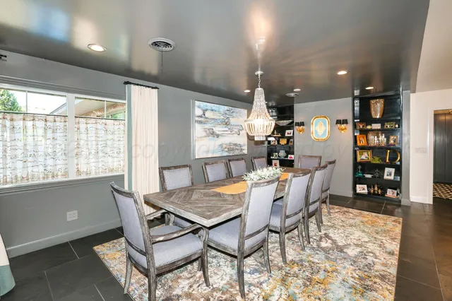a kitchen with stainless steel appliances kitchen island granite countertop a stove and cabinets