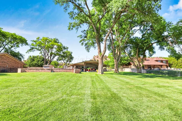 a bathroom with a double vanity sink mirror and shower